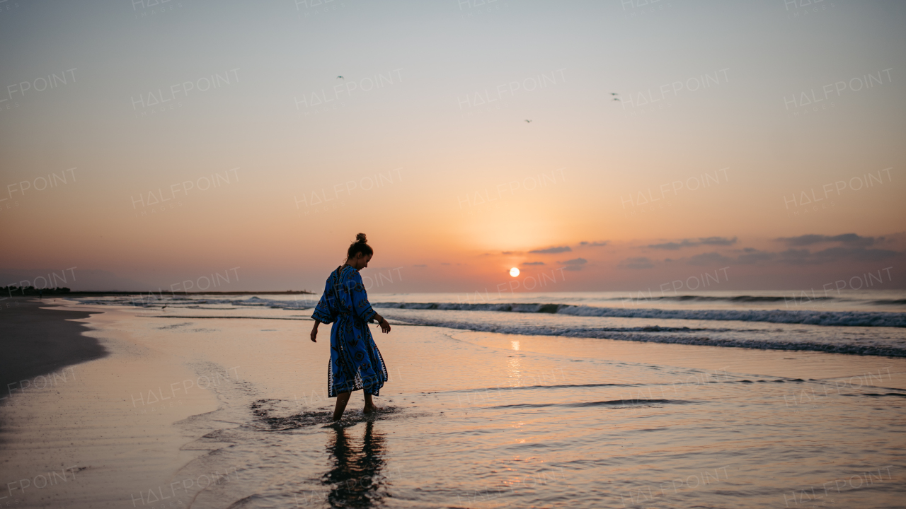 Young woman enjoying time at the sea.