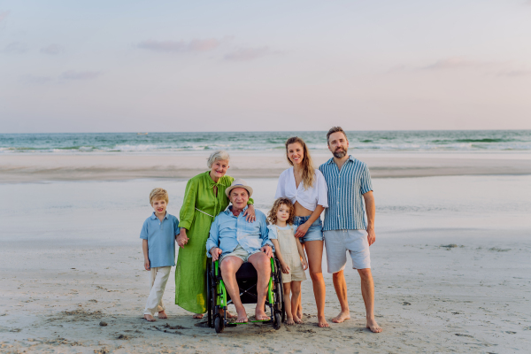 Portrait of multi generations family with kids at sea in exotic country.