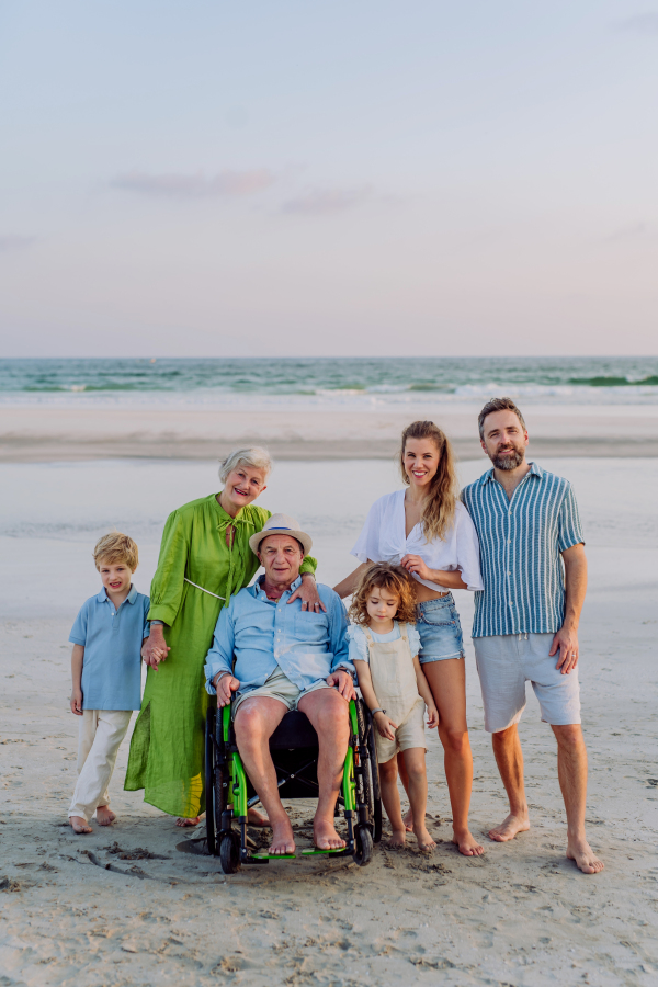 Portrait of three geneartions family with little kids enjoying time at sea in an exotic country.