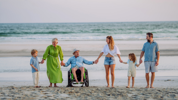 Portrait of three geneartions family with little kids enjoying time at sea in an exotic country.