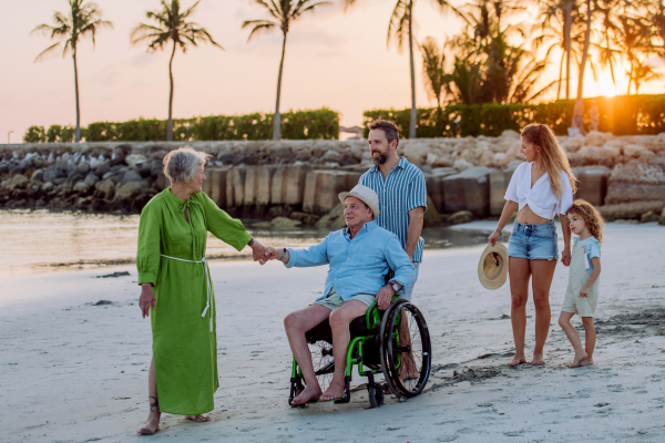 Multi generations family with little kids enjoying time at the sea in exotic country.