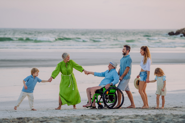 Multi generations family with little kids enjoying time at the sea in exotic country.