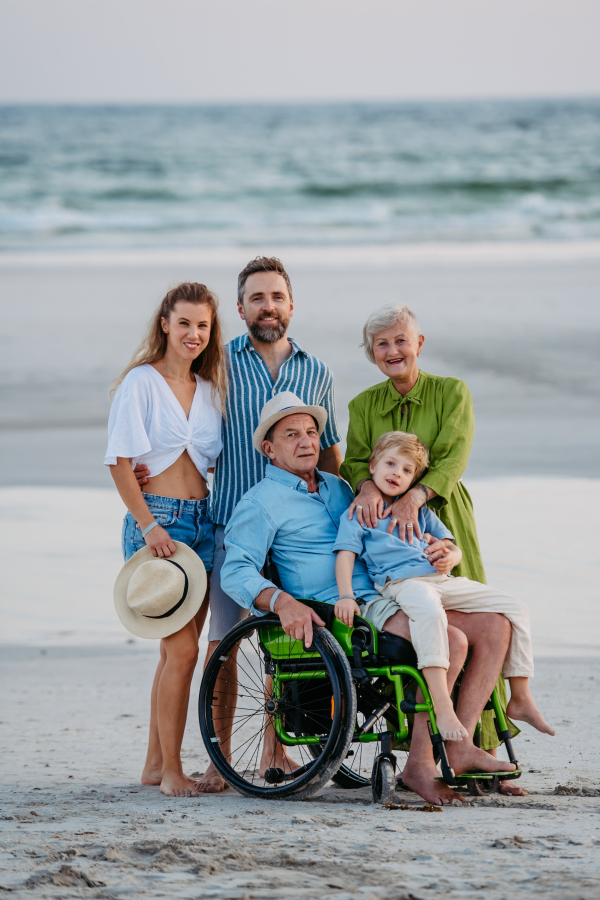 Portrait of multi generations family with kids at sea in exotic country.