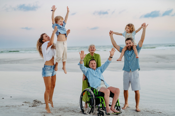 Portrait of multi generations family with kids at sea in exotic country.