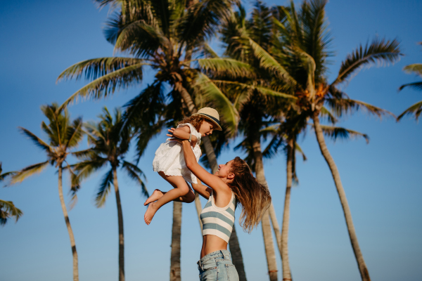 Mother enjoying holiday in exotic country with her little daughter.