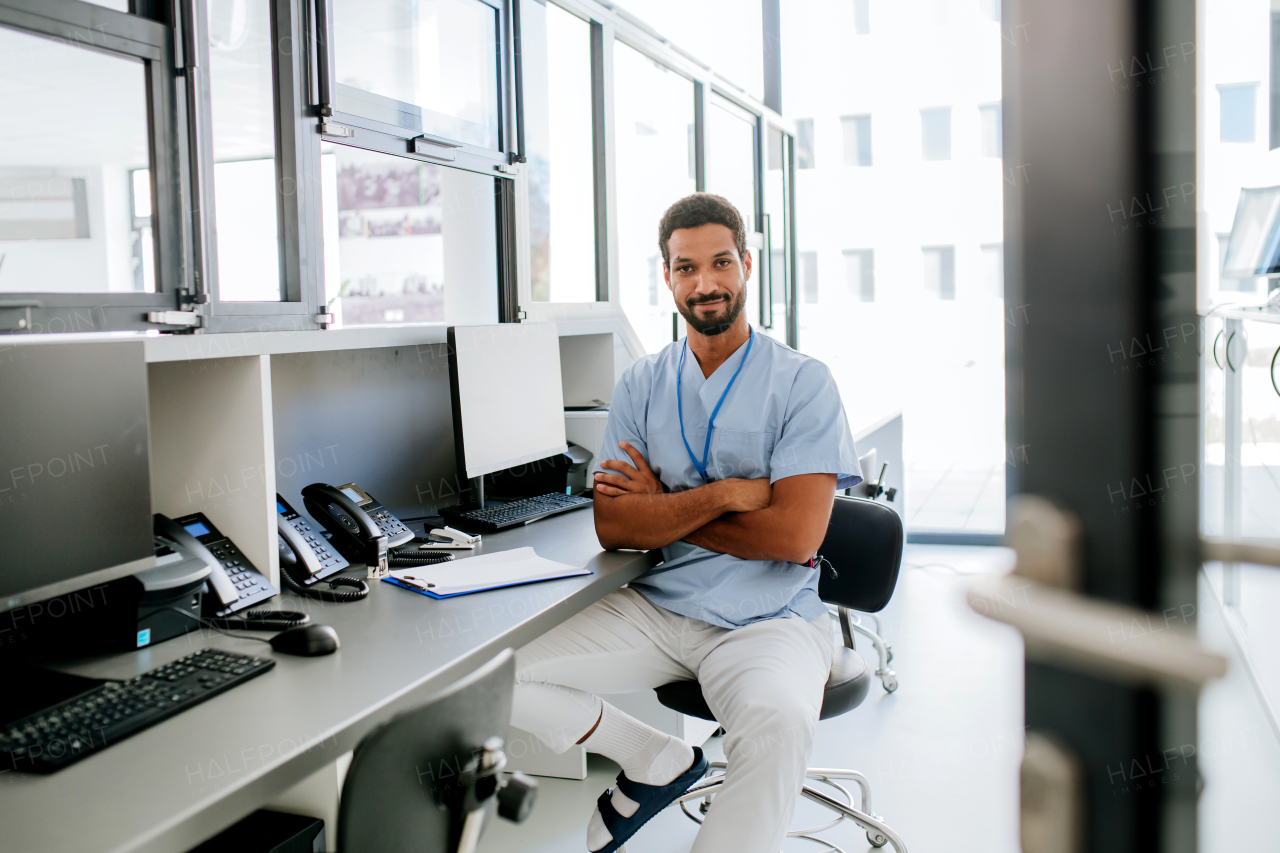 Portrait of young doctor working in the hospital office.