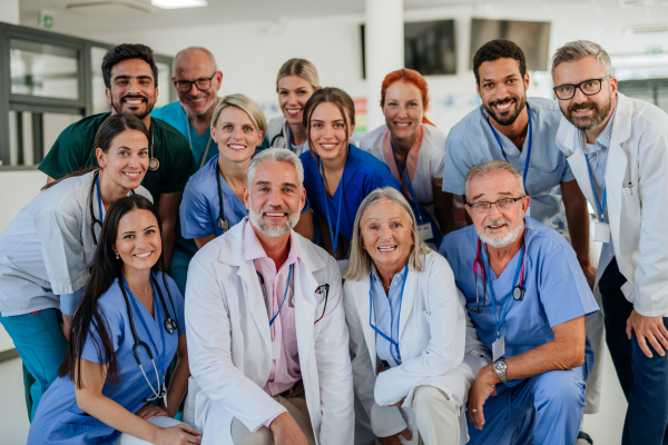 Portrait of happy doctors, nurses and other medical staff in a hospital.