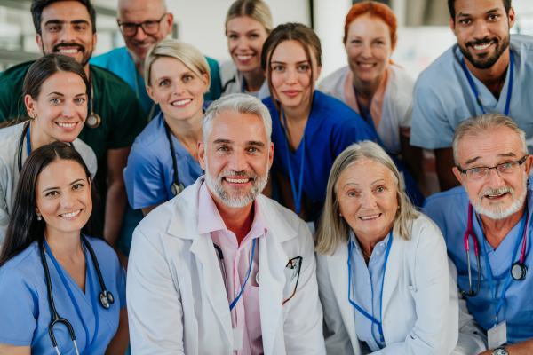 Portrait of happy doctors, nurses and other medical staff in a hospital.