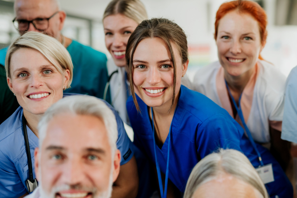 Portrait of happy doctors, nurses and other medical staff in a hospital.