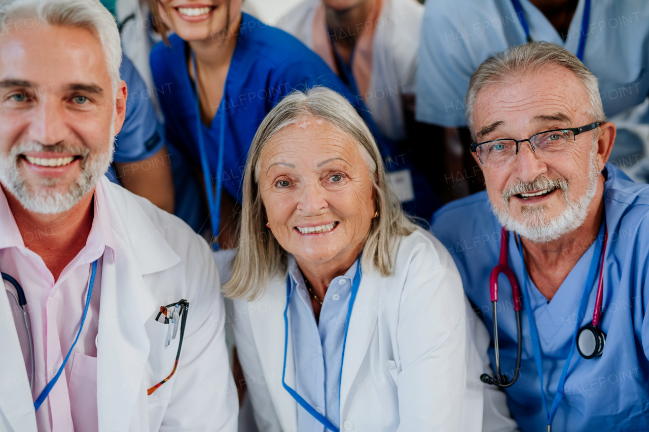 Portrait of happy doctors, nurses and other medical staff in a hospital.