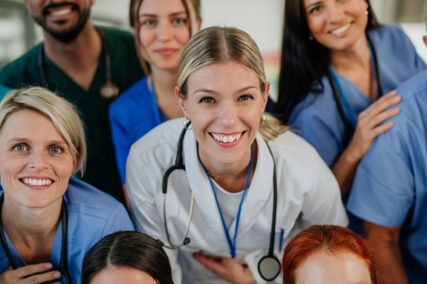 High angle view of happy doctors, nurses and other medical staff in a hospital.