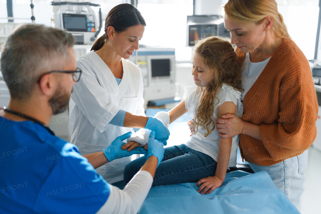 Little girl with mother in surgery examination.