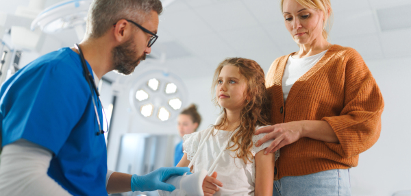 Little girl with mother in surgery examination.