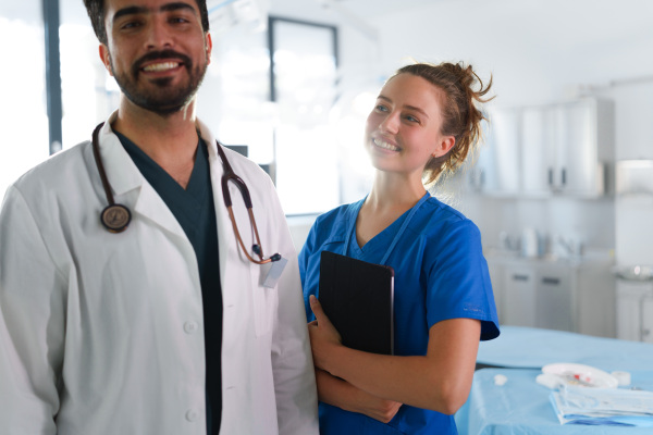 Portrait of young surgeon and his assistant at surgeon hall.