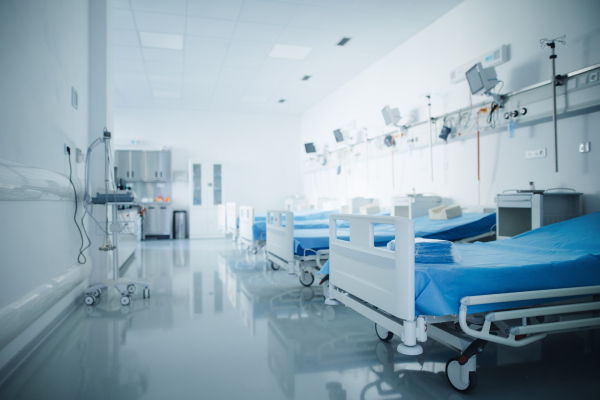 Close-up of empty hospital room with a bed.