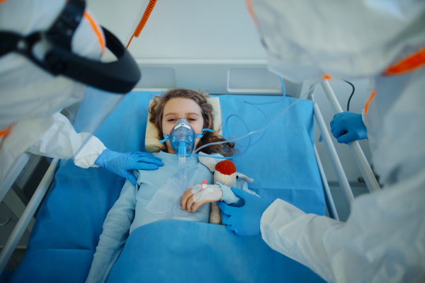 Close-up of girl with infection disease lying in hospital room.