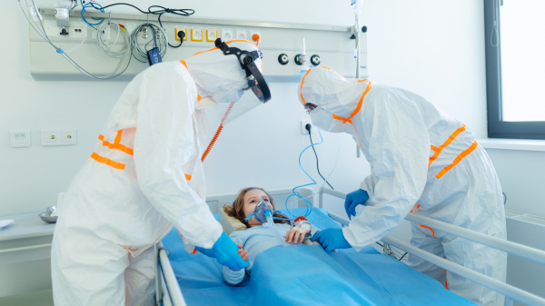 Close-up of girl with infection disease lying in hospital room.