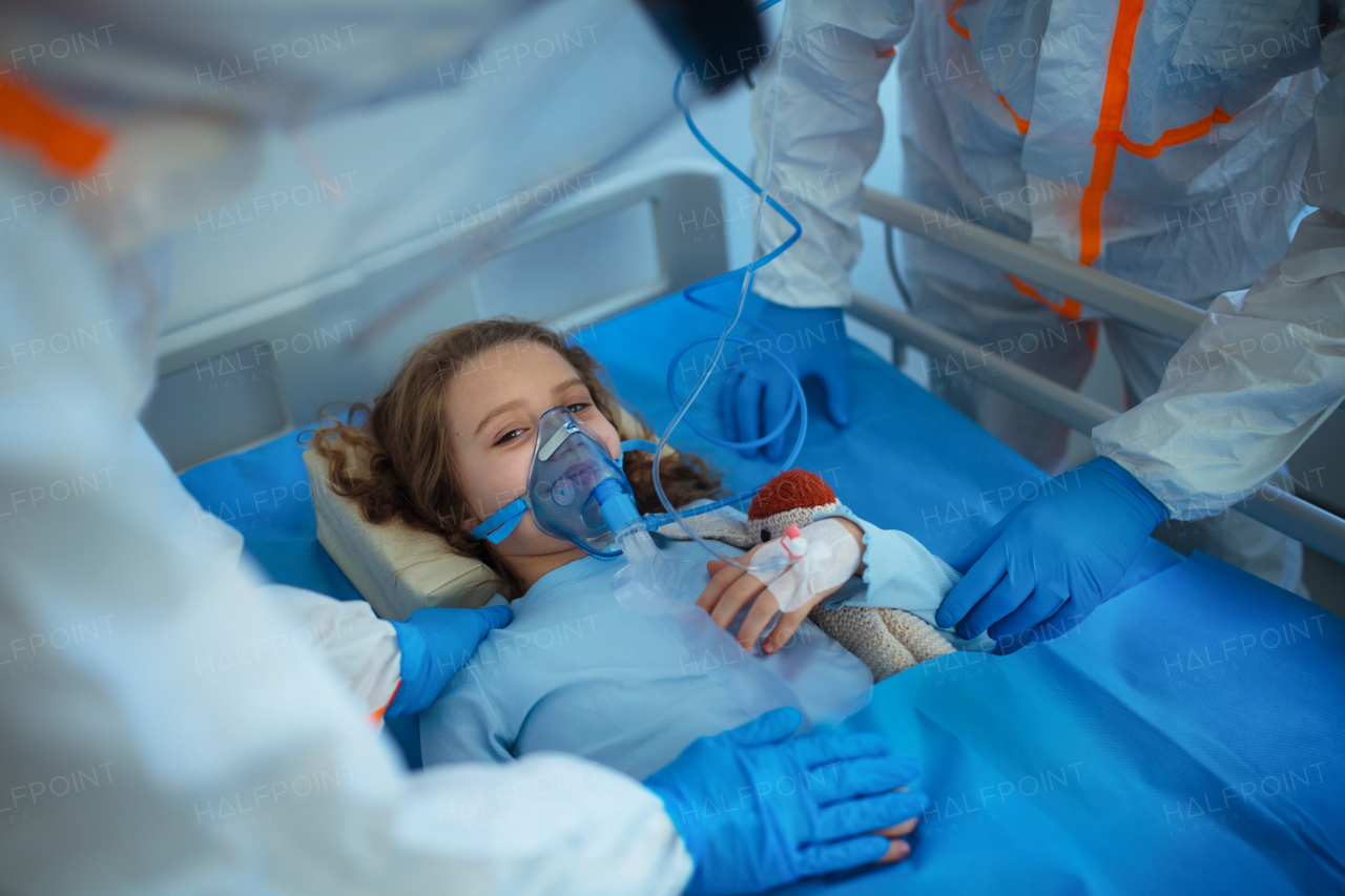 Close-up of girl with infection disease lying in hospital room.