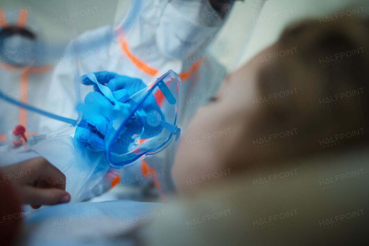 Close-up of girl with infection disease lying in hospital room.