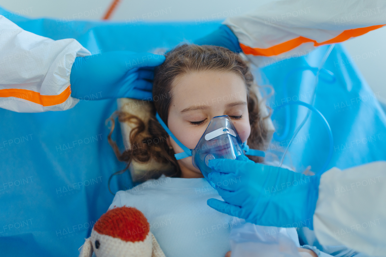 Close-up of girl with infection disease lying in hospital room.