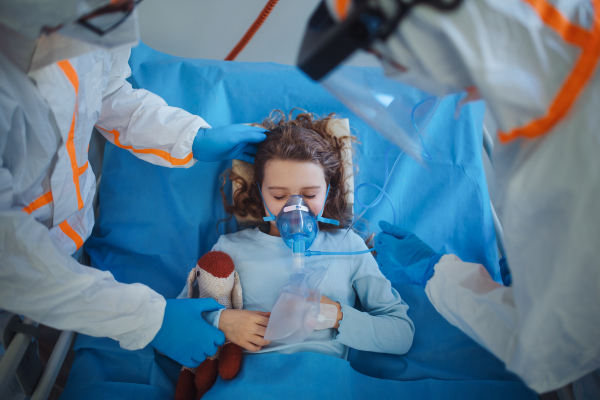 Close-up of girl with infection disease lying in hospital room.