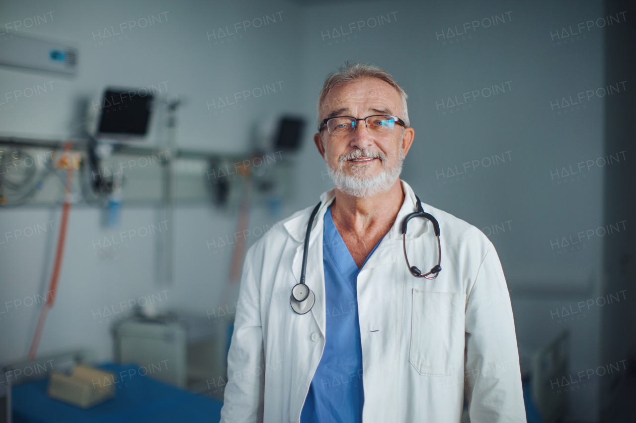 Portrait of elderly doctor at a hospital room.