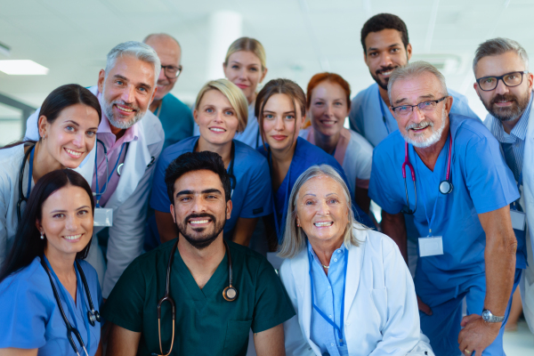 Portrait of happy doctors, nurses and other medical staff in a hospital.