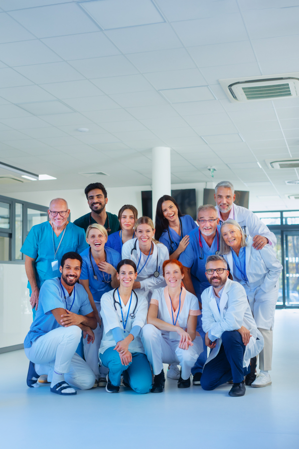 Portrait of happy doctors, nurses and other medical staff in a hospital.