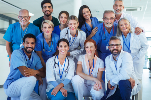 Portrait of happy doctors, nurses and other medical staff in a hospital.