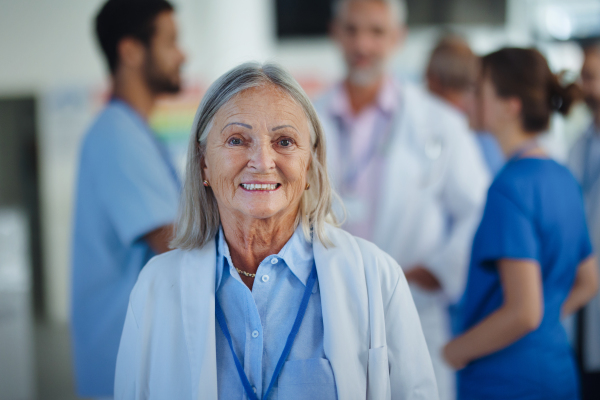 Portrait of elderly doctor woman at a hospital room.