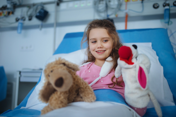 Portrait of little girl in a hospital room with her toys.