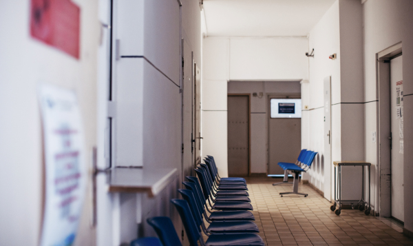 Outdated waiting area in hospital. Plastic chairs, hospital lobby. Outdated furniture hospital equpiment.