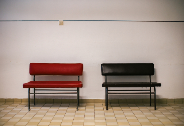 Close up of vingate lobby benches in hospital. Faux leather or vinyl chairs in waiting room. Outdated furniture hospital equpiment.