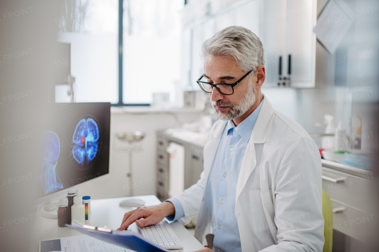 Portrait of sad doctor looking at an MRI scan, patient's bad test results, feeling helpless. Recurrence of the disease