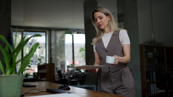 A video of female worker worikng on her laptop in the office. Concept of the corporate work.