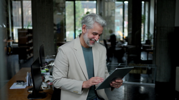 A video of male succesfull business leader working in his office.