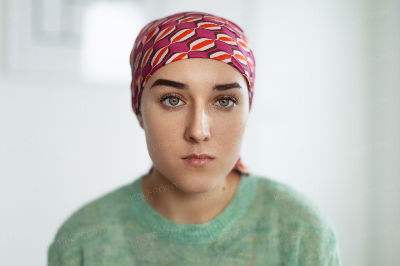 A portrait of unhappy pensive woman with cancer.