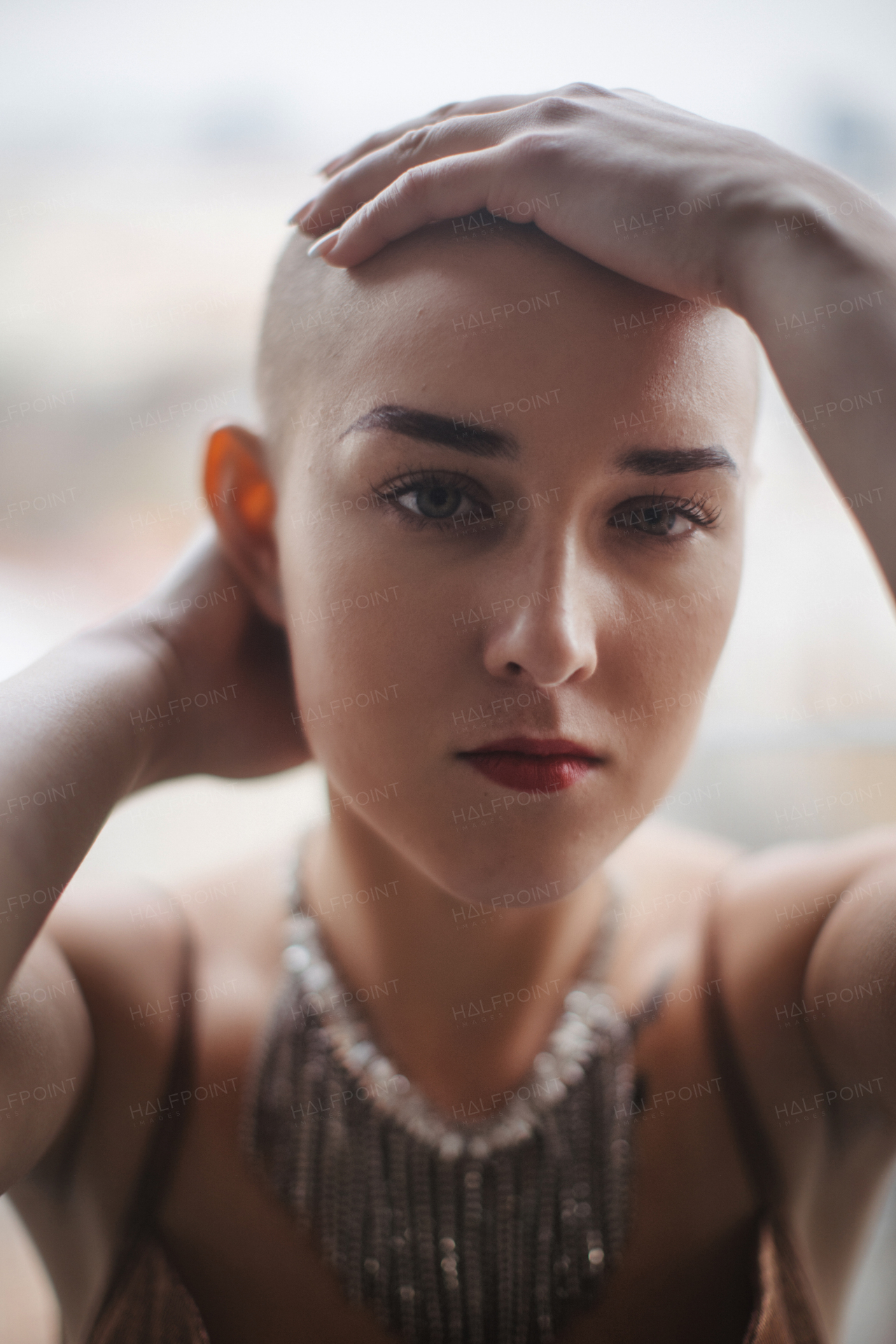 Portrait of beautiful woman, cancer awareness concept. Strong female oncology patient, determined and confident.