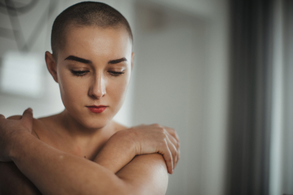 Portrait of beautiful woman, cancer awareness concept. Strong female oncology patient, determined and confident.