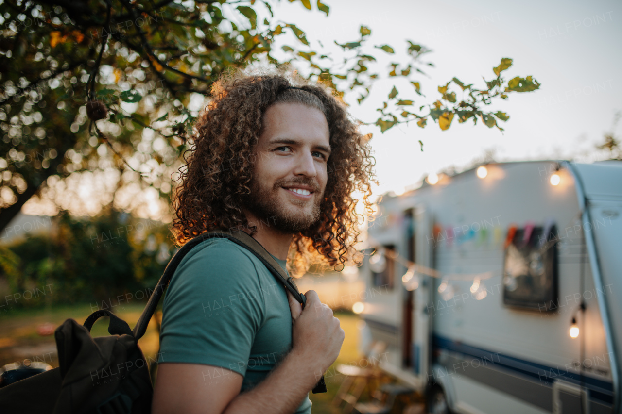 Young man is on a camping trip in nature alone. Caravan traveling for young people