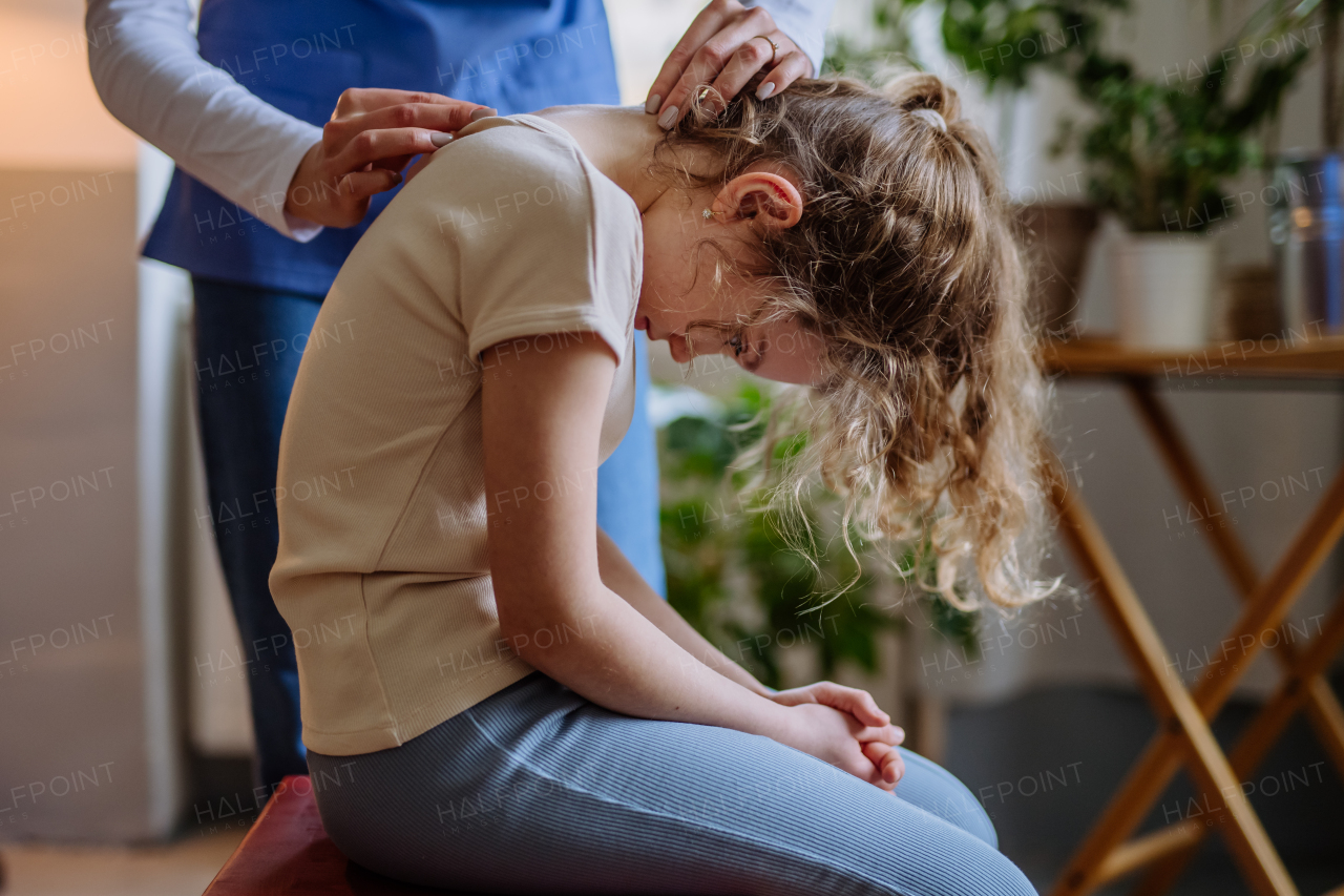 Little girl doing exercise with a physiotherapist.