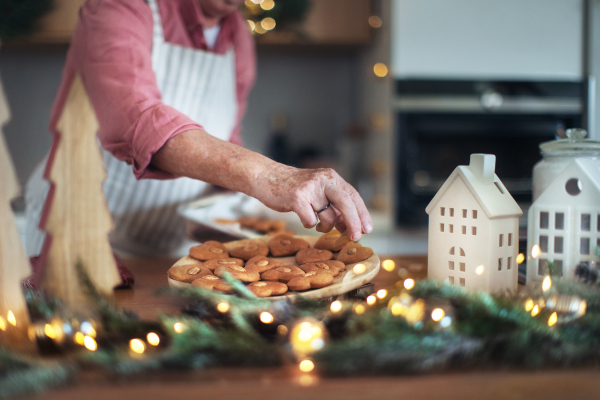 Close-up of senior man baking gingerbreads.