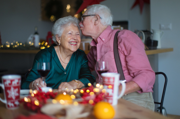 Happy senior couple celebrating New Year eve together.