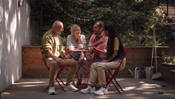 Video of group of friends taking a coffee break after volunteers meeting in their community space.