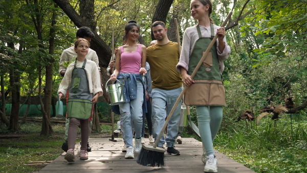 Low section video of Group of group of volunteers on their way to cleaning the forst from plastic garbage.