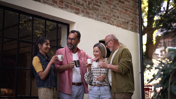 Video of group of friends taking a coffee break after volunteers meeting in their community space.