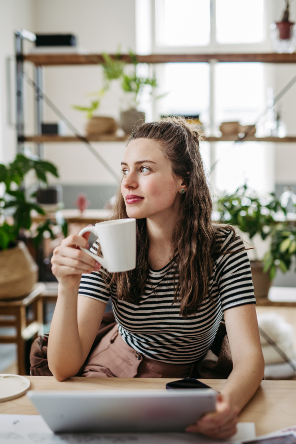 Young woman working in coworking office.