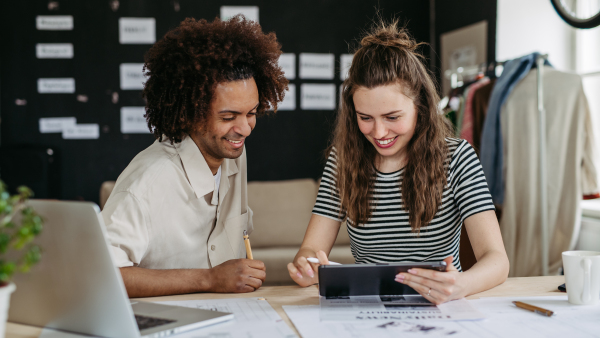 Young colleagues working together in a startup company.