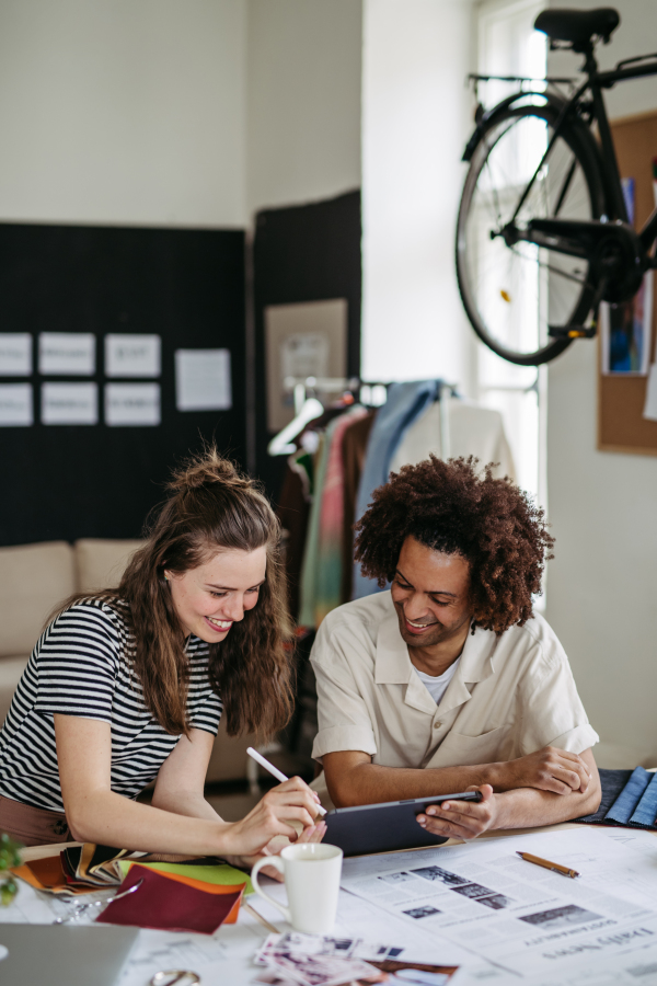 Young colleagues working together in a startup company.