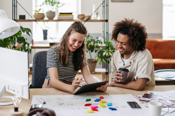 Young colleagues working together in a startup company.